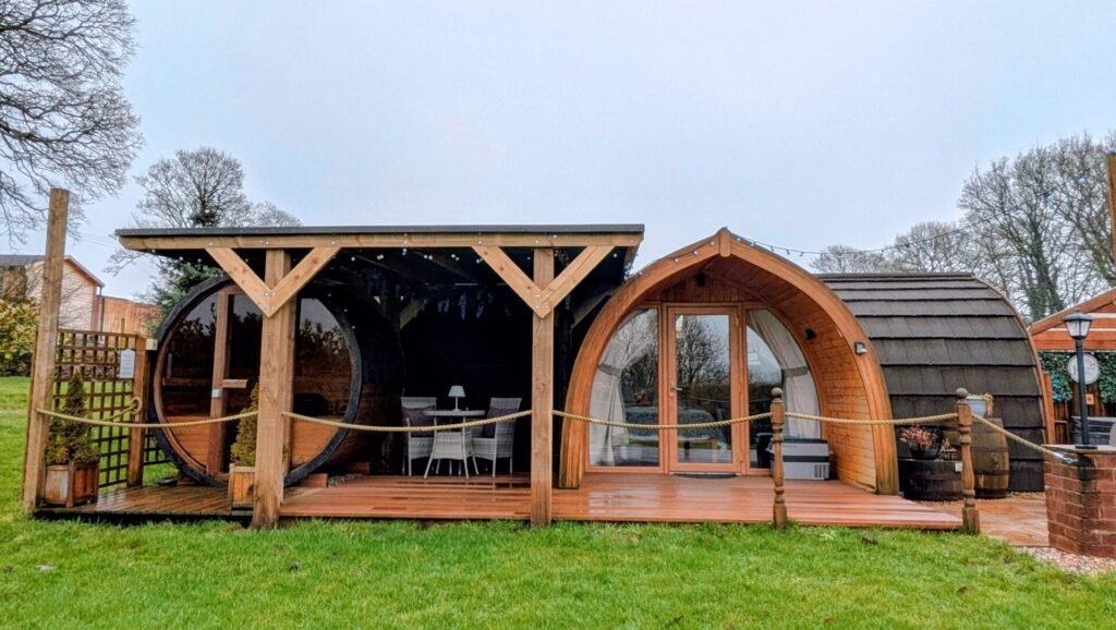 Buttercup glamping pod at hedgerow luxury glamping with a covered hot tub and sauna